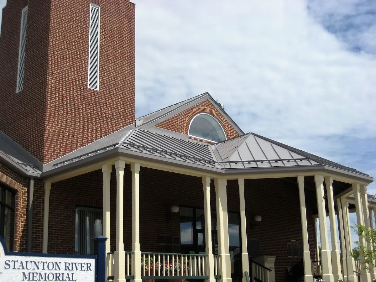 Skilled roofing craftsmen working on a residential roof in New Durham